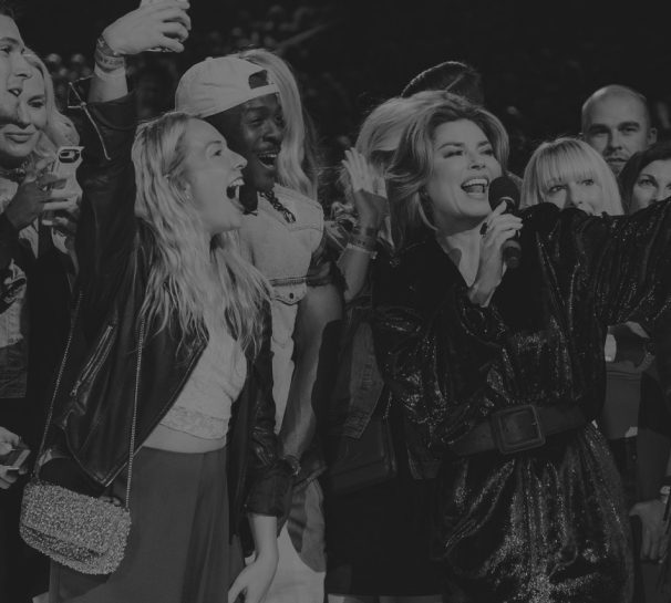 group of artists celebrating on stage