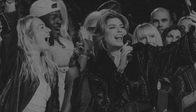 group of artists celebrating on stage